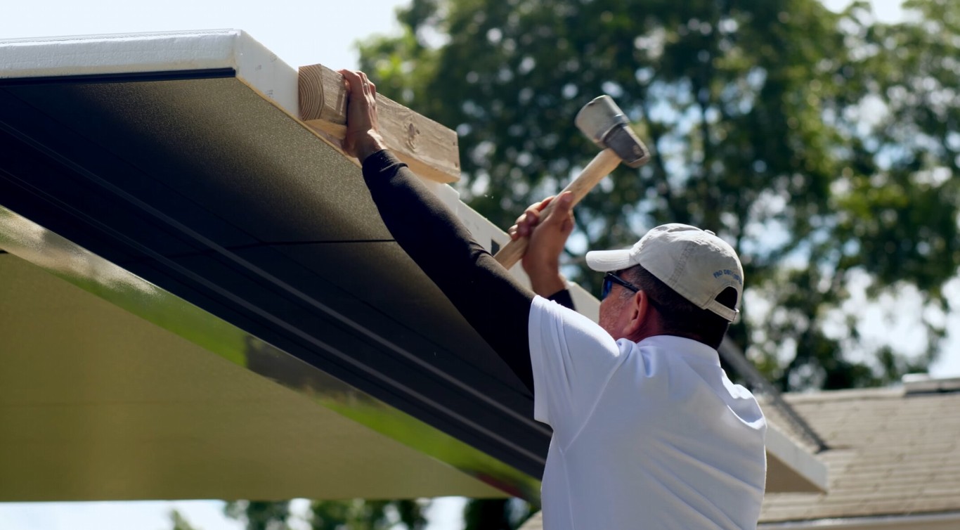 Worker performing sunroom repair and maintenance in San Mateo